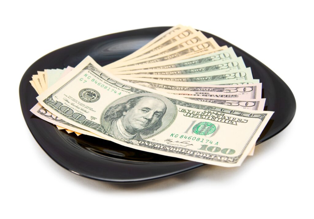 Money in a plate.